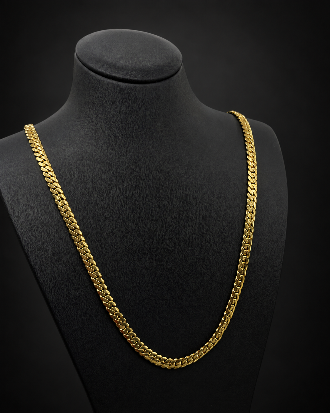 Reference 101580, chain 2: 54.1g 10KT yellow gold Miami Cuban chain, 24 inches long, 6.3mm wide, displayed on a black bust.