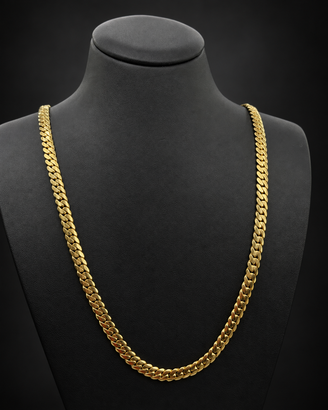 Reference 101580, chain 3: 57.1g 10KT yellow gold Miami Cuban chain, 24 inches long, 6.5mm wide, displayed on a black bust.
